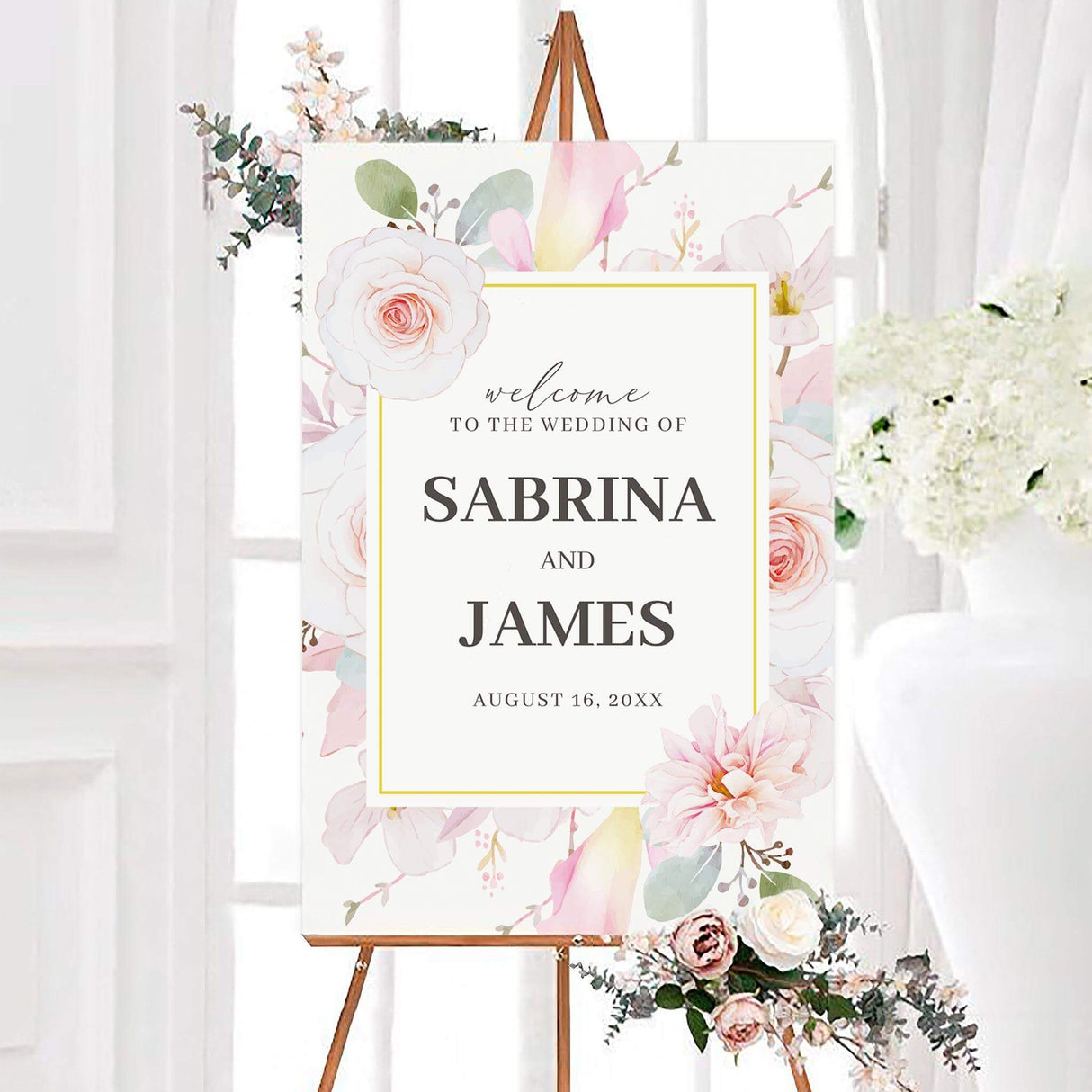 Personalized pink pastel floral wedding welcome sign with soft pink watercolor roses, pastel flowers, green leaves, and a thin gold border. The center features the couple’s names and wedding date in elegant gray typography.