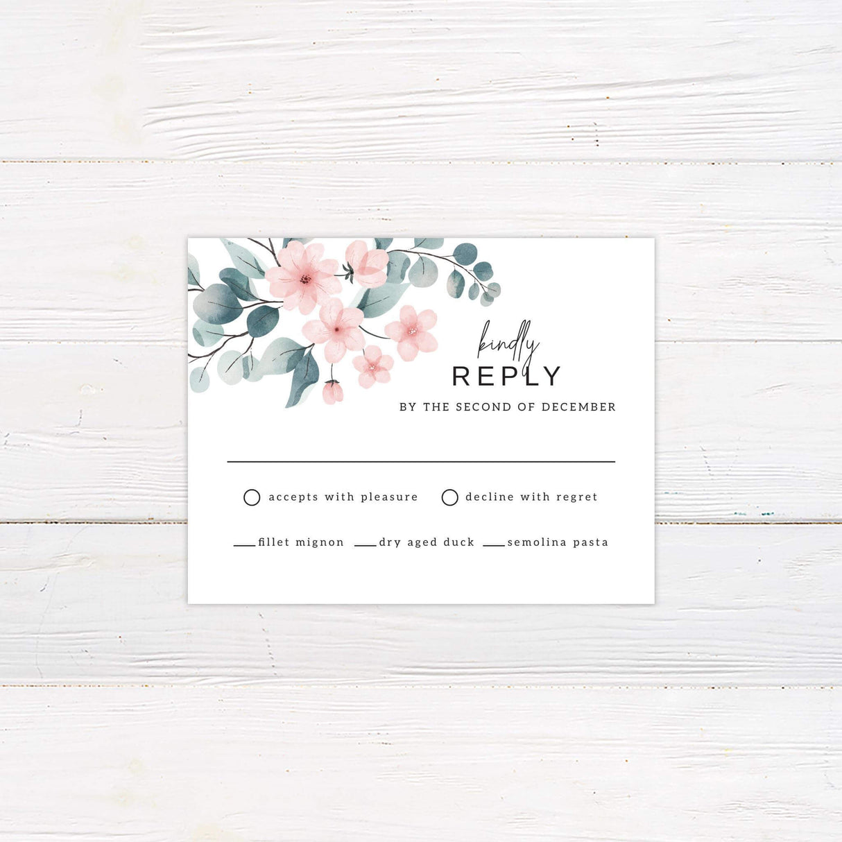RSVP card with blush watercolor flowers and soft eucalyptus leaves on white background.