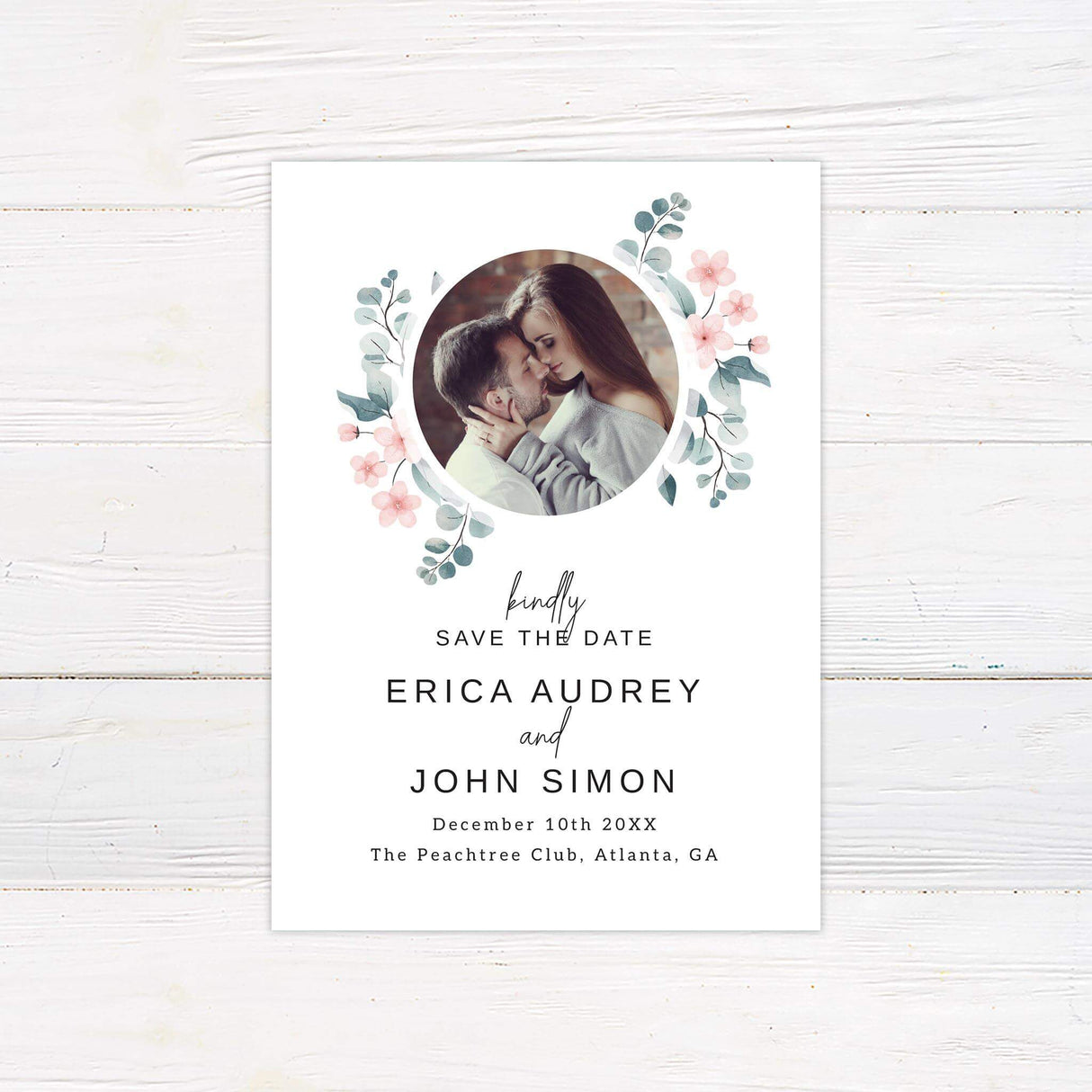 Save the Date card with soft pink petals, eucalyptus leaves, and romantic minimalist typography.