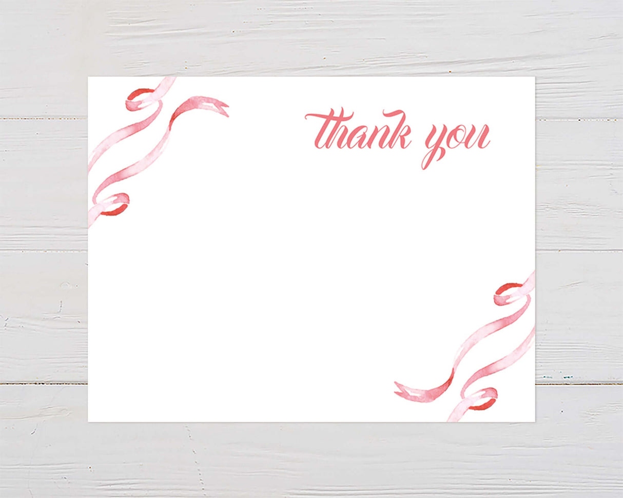 Thank you card with elegant pink ribbon design on white background.