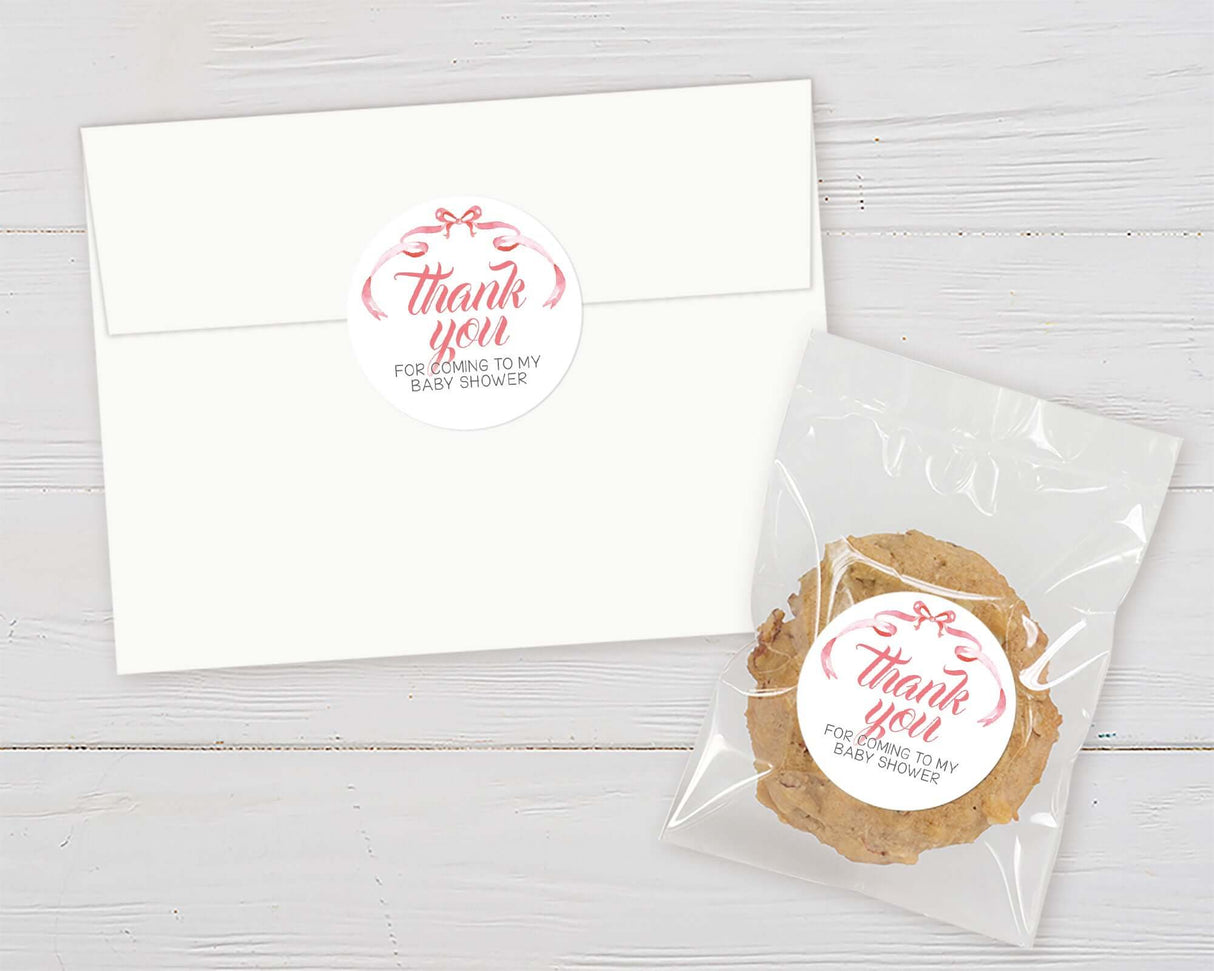 Elegant ribbons baby shower thank you cookie and card set on white wooden background