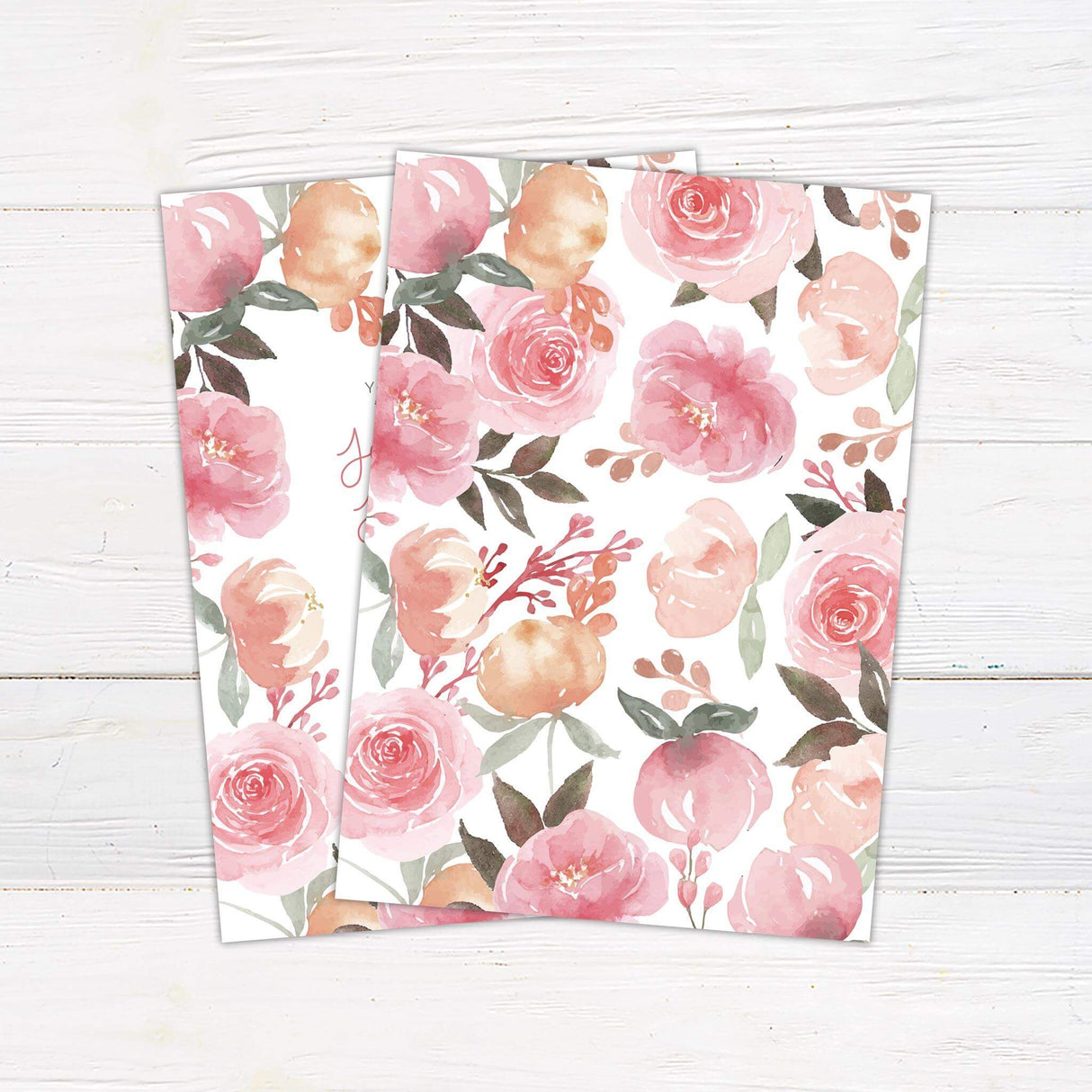 Wedding invitation with watercolor pink and peach garden roses framing the text, with playful script and serif fonts on a white background. - back side