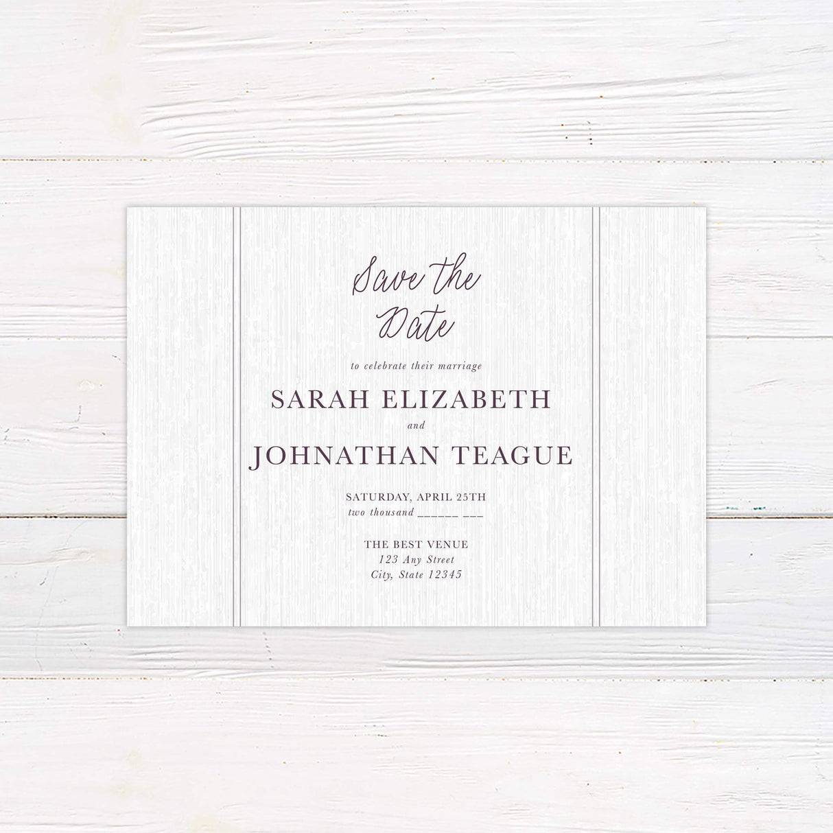 Save the Date card featuring a plum floral monogram and clean modern text on a neutral textured background.