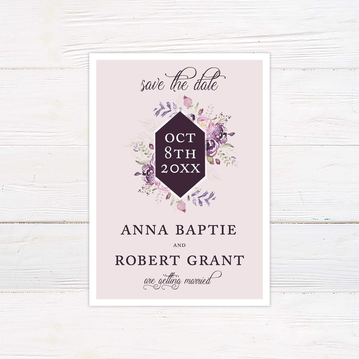 Save the Date card with romantic watercolor florals in plum and blush, accented with stylish typography.