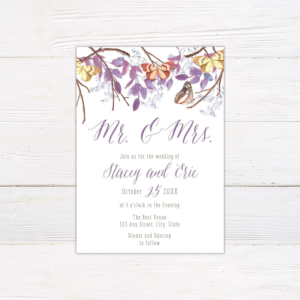 Watercolor wedding invitation with purple leaves, orange and yellow butterflies, rustic branches, and elegant script fonts.