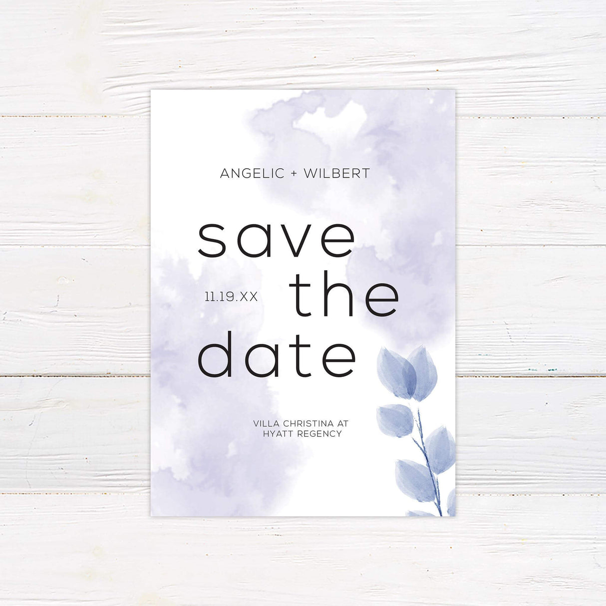 Save the date card with watercolor purple leaves and simple elegant text layout.s