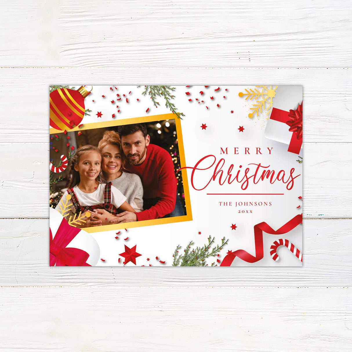 Personalized Christmas card with family photo, red and gold ornaments, candy canes, pine branches, and festive Merry Christmas greeting.