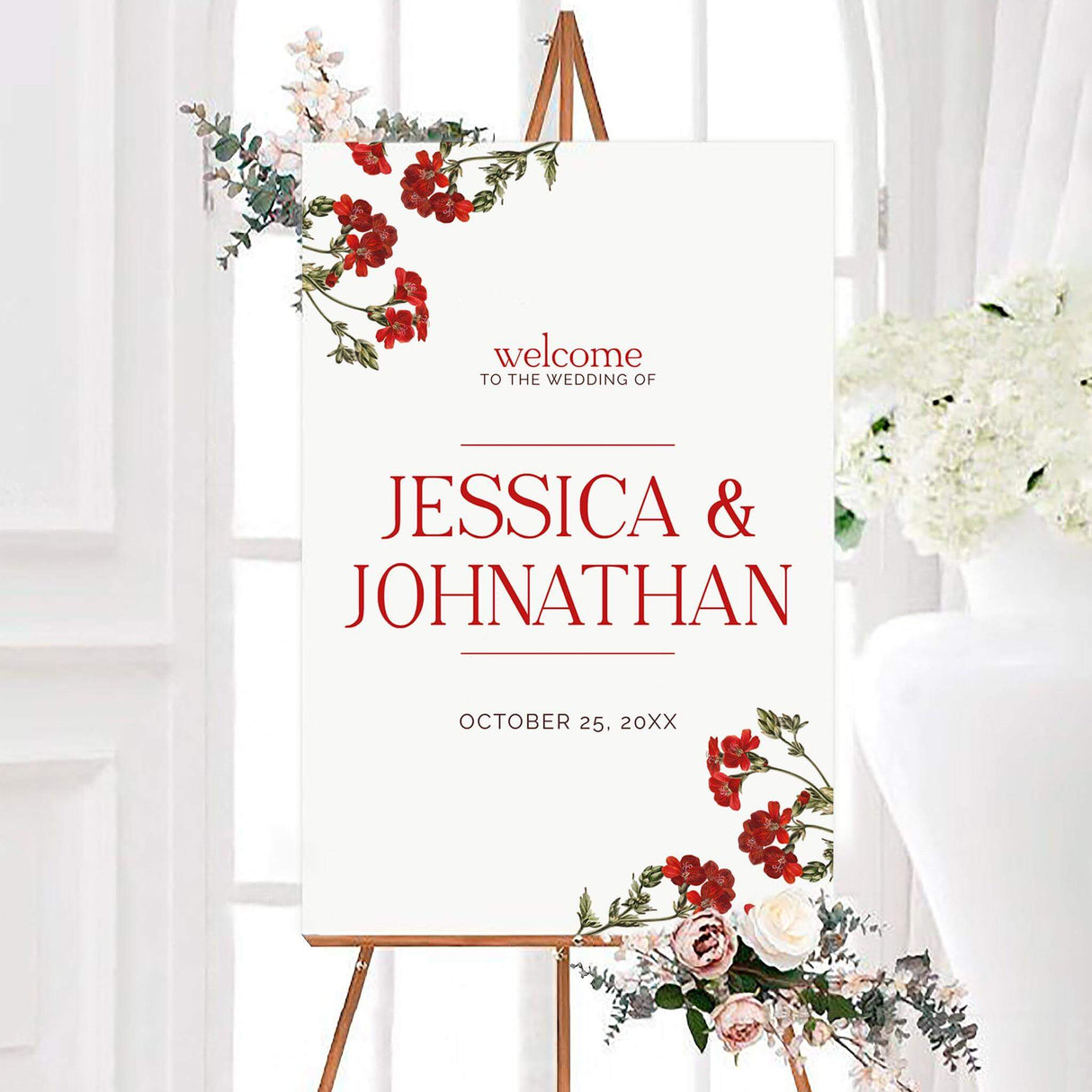 Elegant red blooms wedding welcome sign featuring watercolor red flowers and green foliage on a white background. The personalized design displays the couple’s names and wedding date in classic red typography.