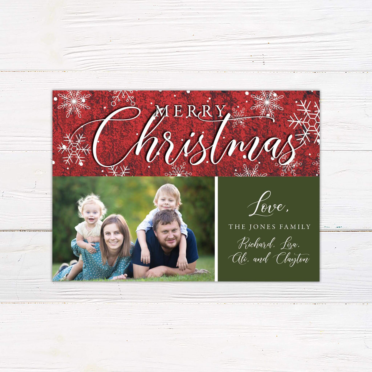 Custom red Christmas card with snowflake accents, bold script typography, and space for a personalized family photo and greeting.