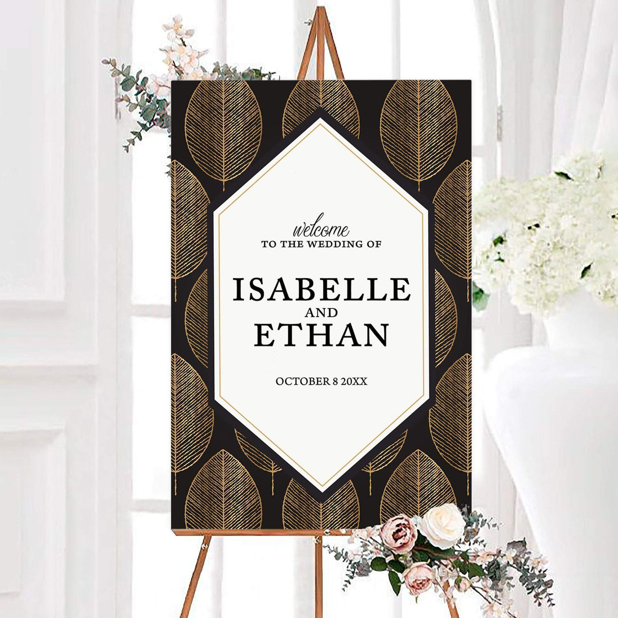 Black and gold regal leaves wedding welcome sign featuring large golden leaves surrounding a white geometric center panel. The personalized design displays the couple’s names and wedding date in elegant black typography.