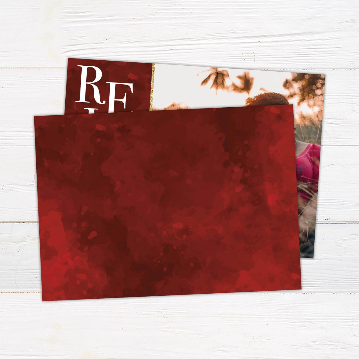 A holiday card design featuring the word “Rejoice” with a snowflake accent and a family photo area. Elegant and customizable for Christmas greetings. - back.