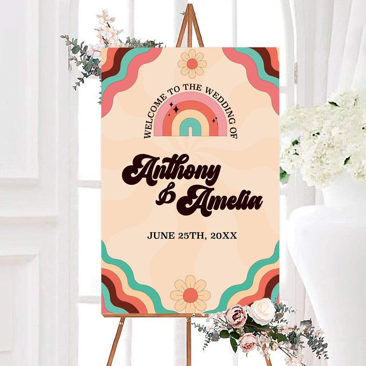 Retro rainbow wedding welcome sign featuring a colorful rainbow, daisies, wavy stripes, and personalized couple names. The 70s-inspired design uses coral, turquoise, pink, burgundy, and cream tones.