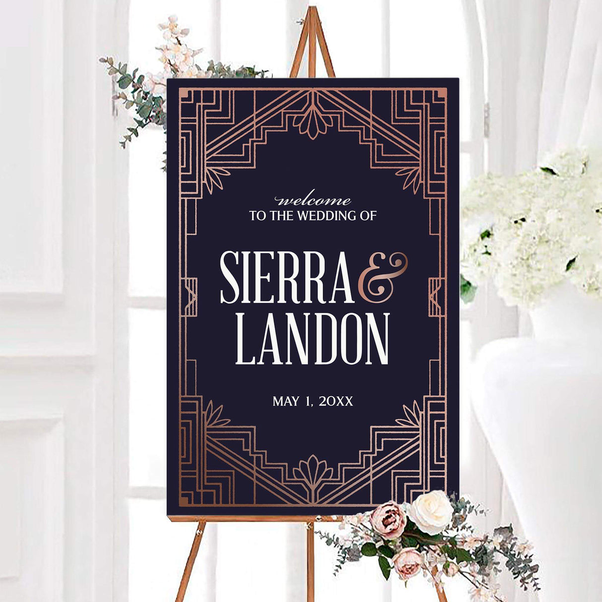 Bold welcome sign in navy and rose gold with deco borders and tulip accents, matching the wedding suite.