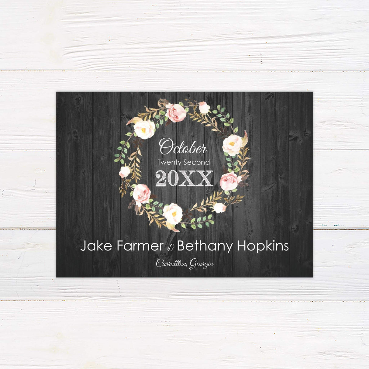 Save the Date card featuring coordinating floral wreath on a rustic wood texture, setting a romantic, country tone.