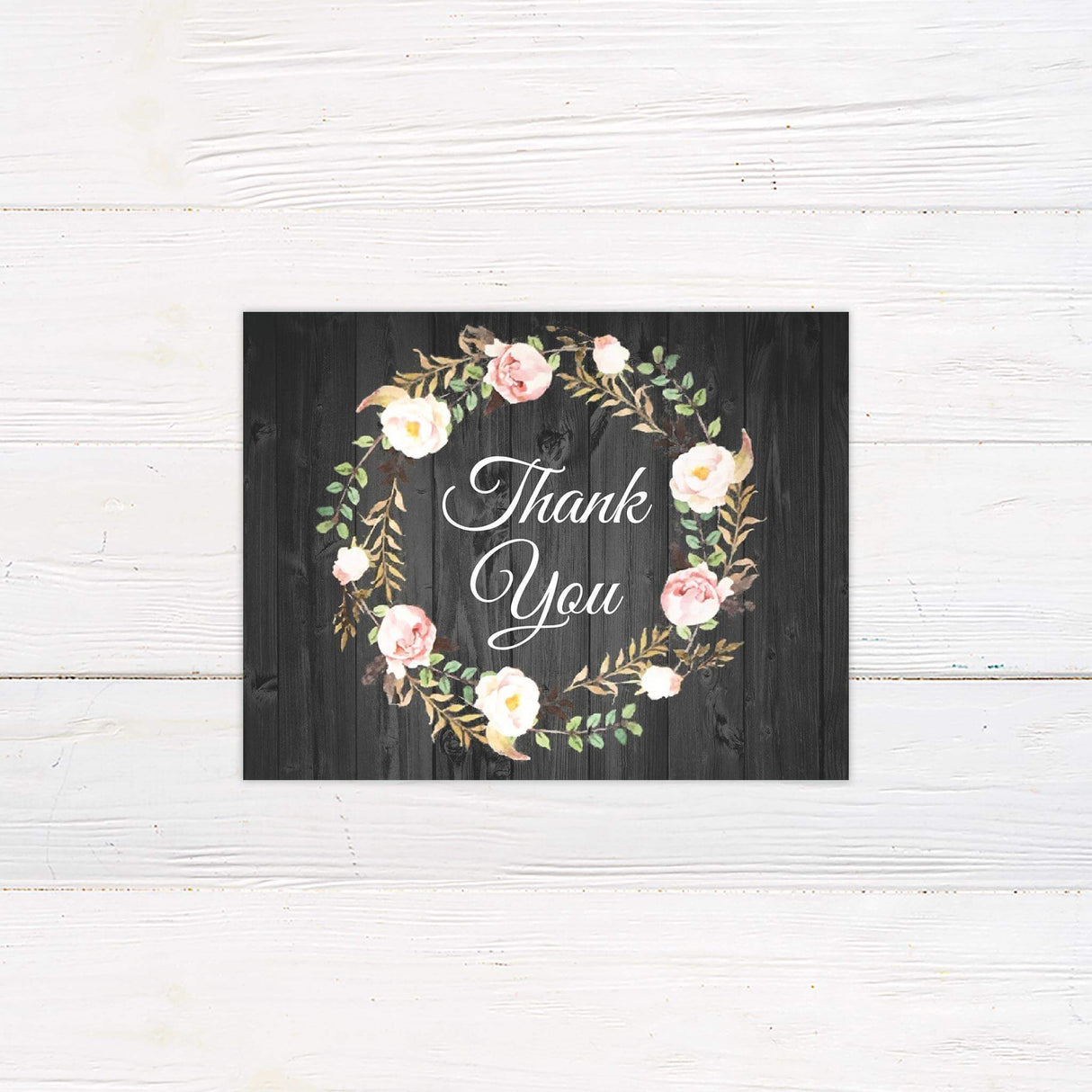 Printed thank you card with matching floral wreath and rustic wood design, perfect for rustic post-wedding gratitude.