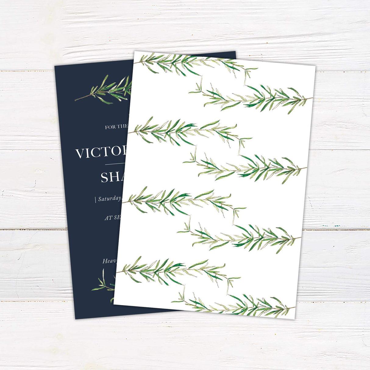 Elegant rosemary sprig wedding invitation with dark charcoal background, serif and italic fonts, and watercolor botanical accents for a rustic wedding theme.- back side