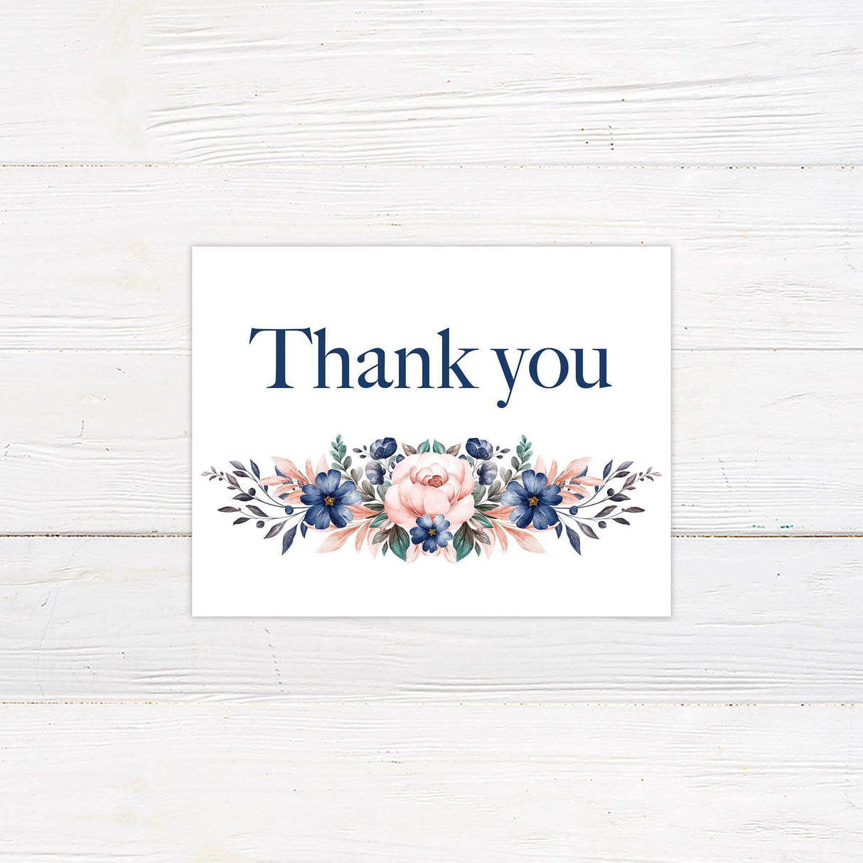 Thank you card with matching watercolor roses and monogram crest for a cohesive floral wedding stationery set.