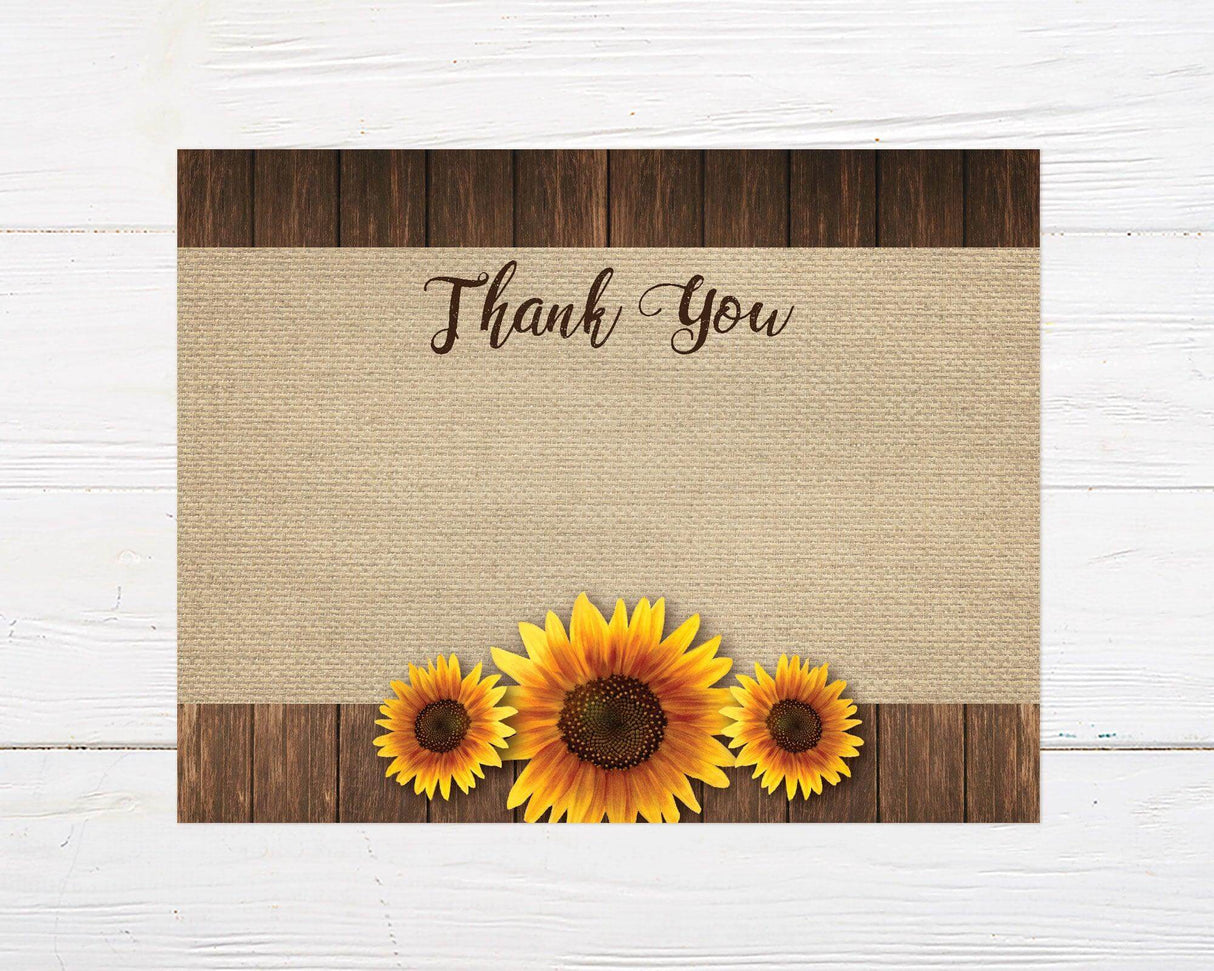 A rustic sunflower bridal shower thank you card with sunflowers on a burlap background. The design features floral artwork and natural textures with space to leave a message for guests.