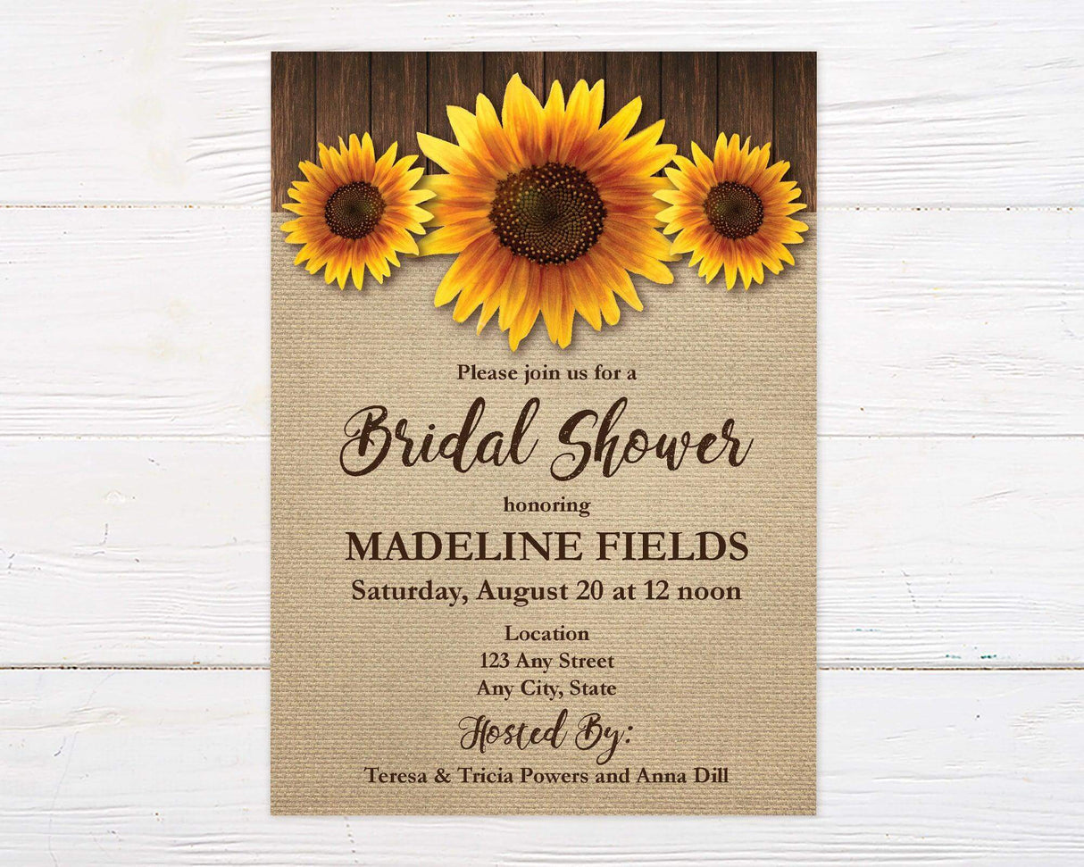 A rustic sunflower bridal shower invitation with sunflowers on a burlap background. The design features floral artwork and natural textures.