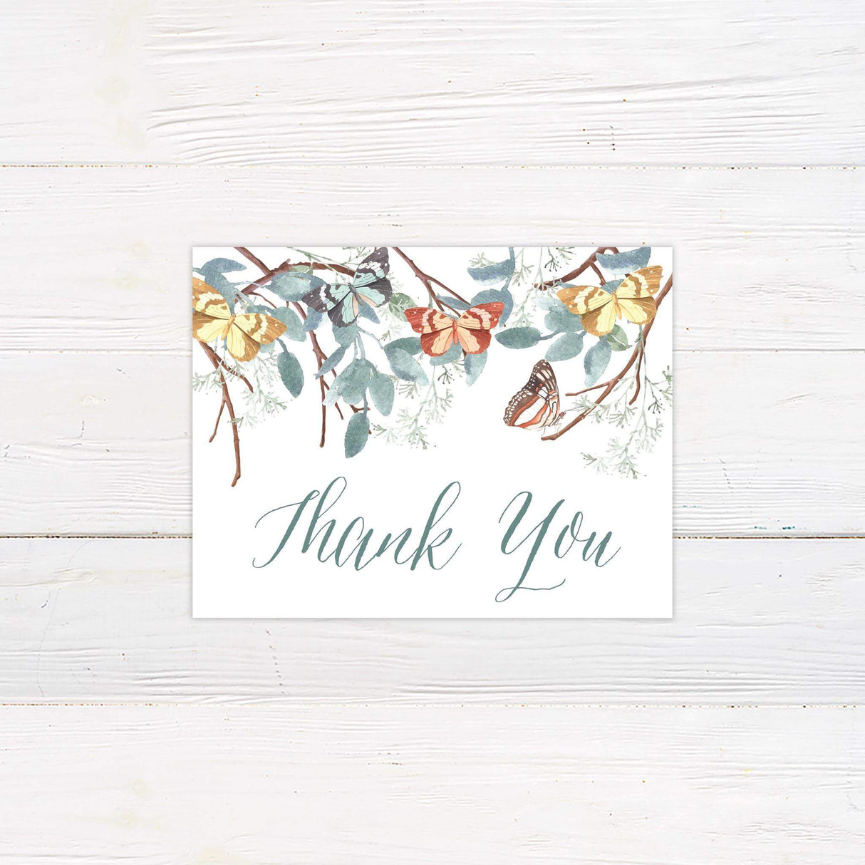 Thank you card with botanical butterfly illustration and sage eucalyptus accents to match the invitation.