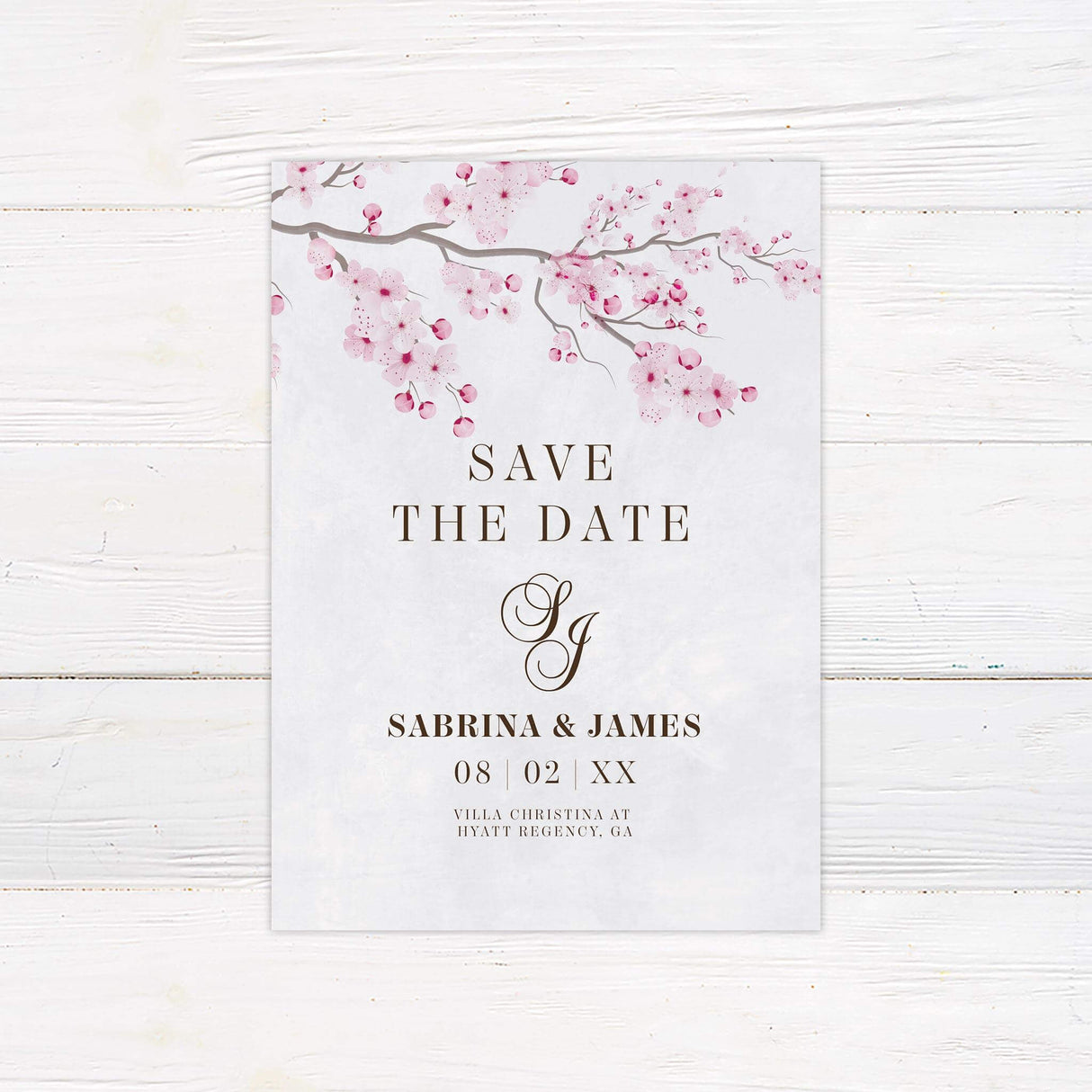 Save the Date card with delicate cherry blossom floral border and romantic spring design.