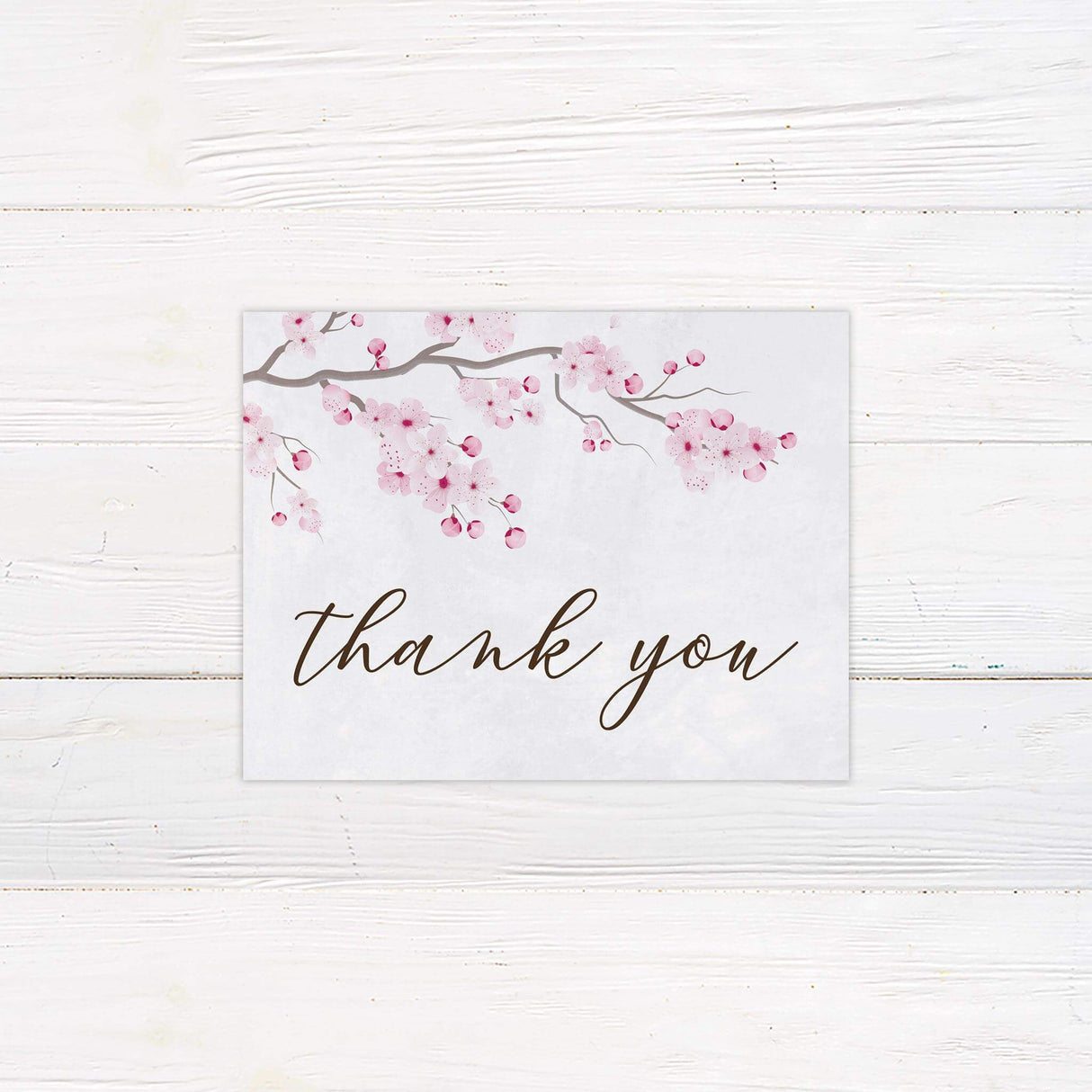 Thank you card with blush sakura illustrations and elegant typography to match cherry blossom theme.