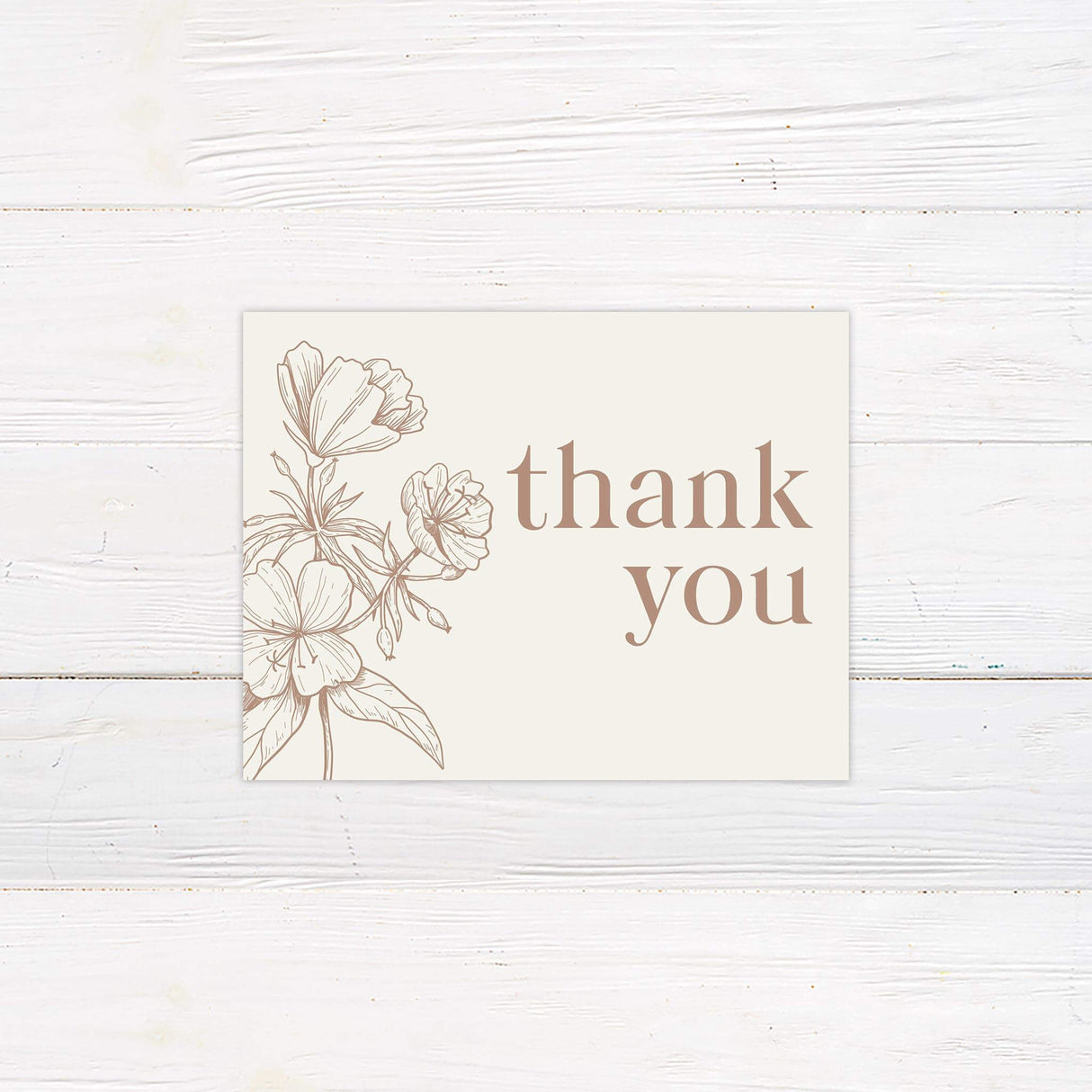 Thank you card with elegant taupe floral line drawings and classic serif font.