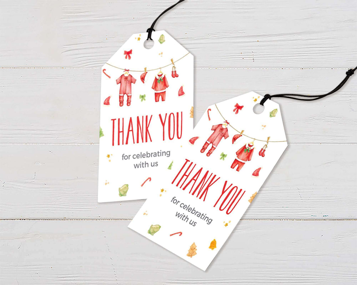 Christmas baby shower thank you tags with festive illustrations and "Thank You for celebrating with us" text, hanging on a white background.