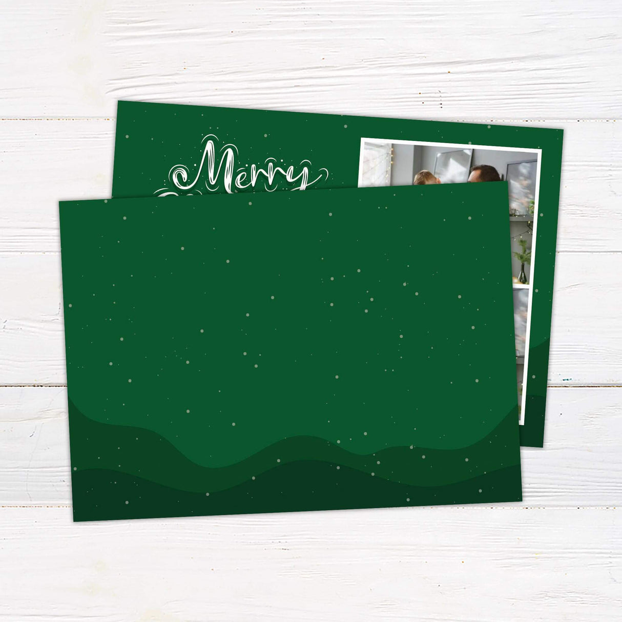 A festive Christmas card with two family photos and Santa Claus illustrations. Includes a “Merry Christmas” greeting and family name personalization. - back.