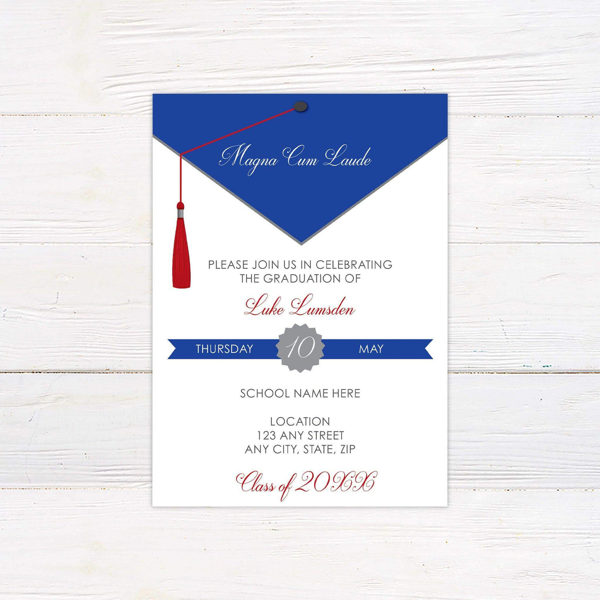 Elegant graduation invitation featuring a minimalist cap and tassel design in customizable school colors. The front includes the graduate's name, graduation date, and location details in a sophisticated layout. The back showcases a portrait of the graduate making it a personalized keepsake for family and friends. Blue.
