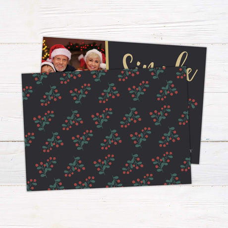 Modern holiday photo card with “Simple Moments Bring Great Joy” message, featuring three family photos, festive fonts, and holly accents on a charcoal background. back side