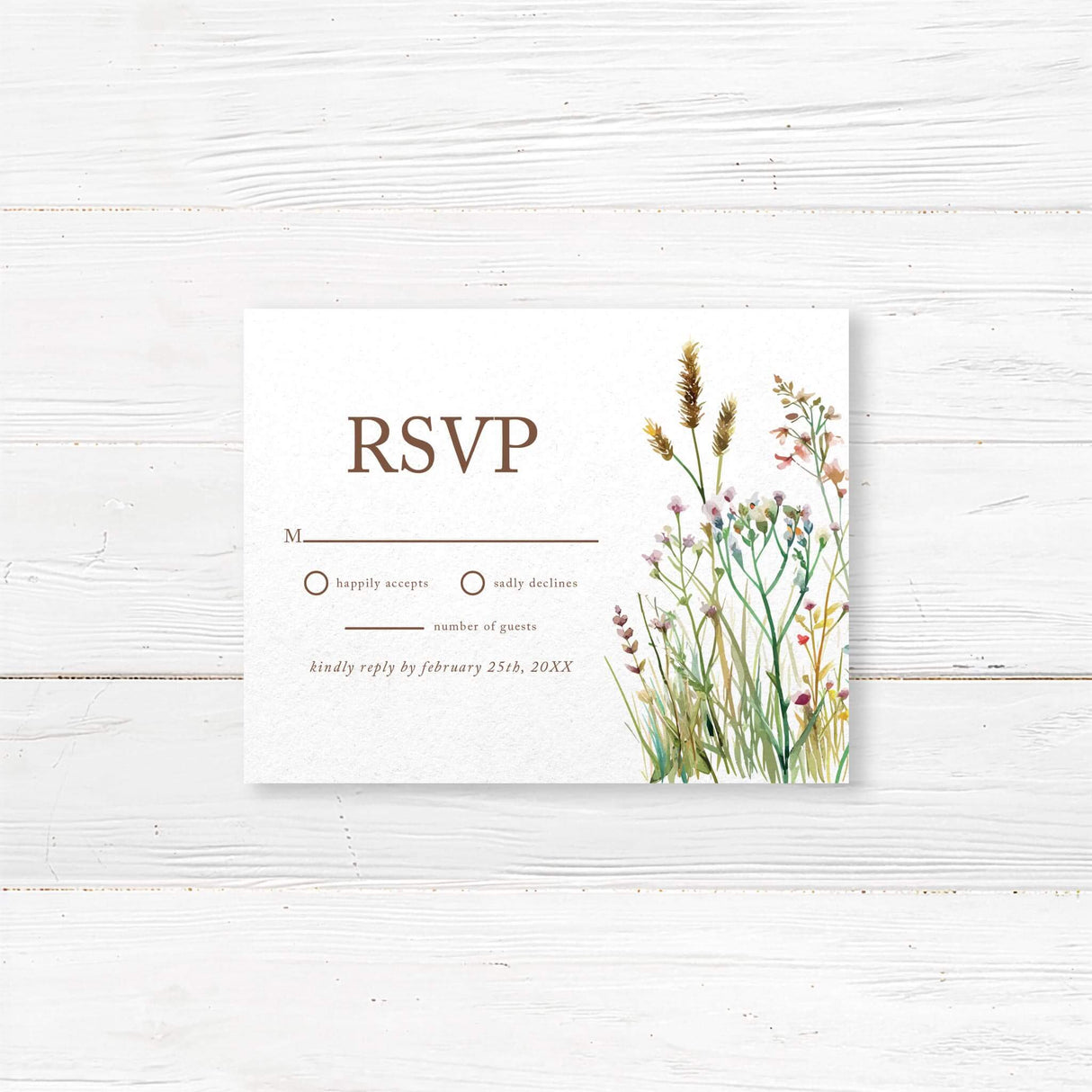 Colorful wildflowers frame an RSVP card, elegantly requesting guests to respond to an upcoming celebration.