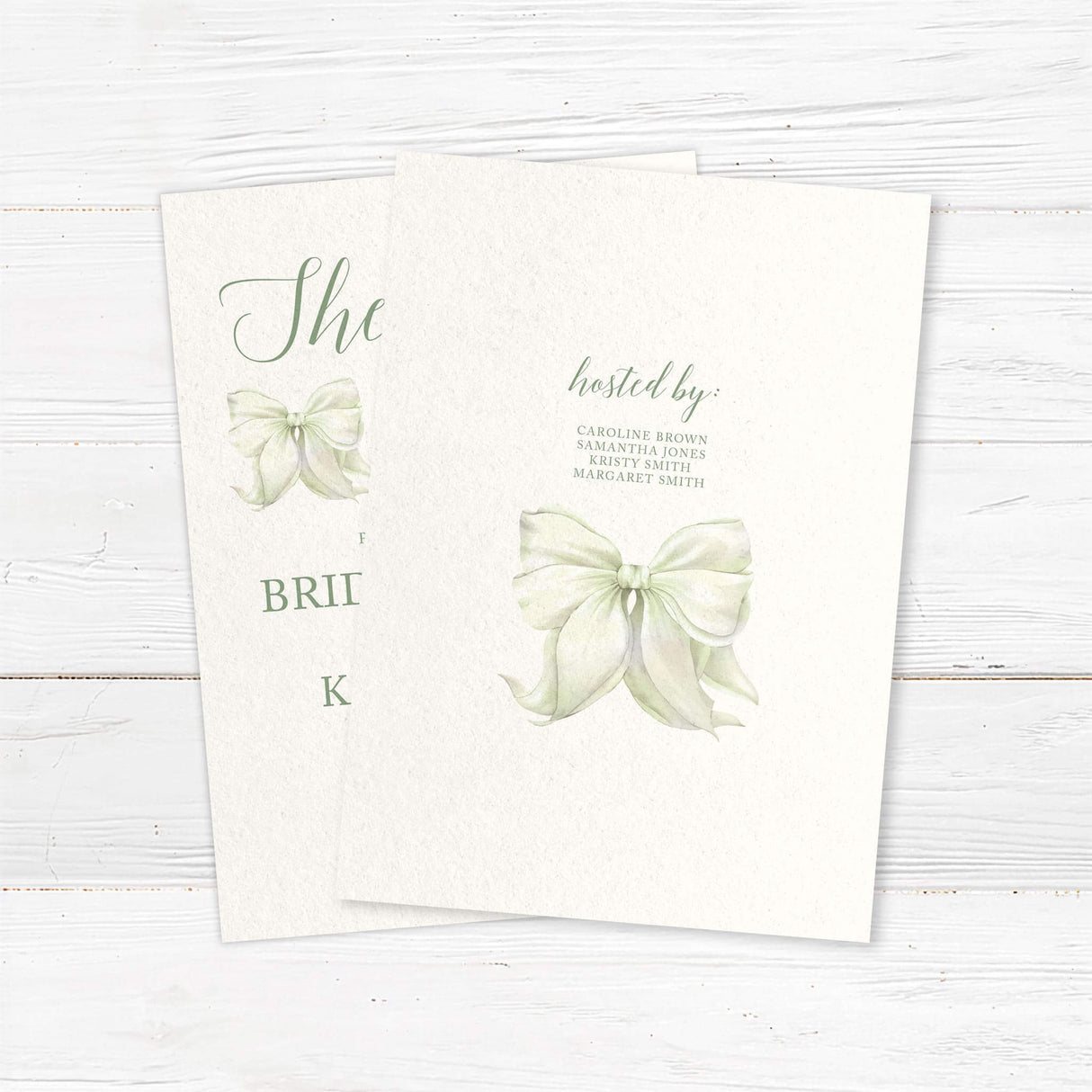 Watercolor bow bridal shower invitation that reads "She’s Tying the Knot" with floral accents, - back