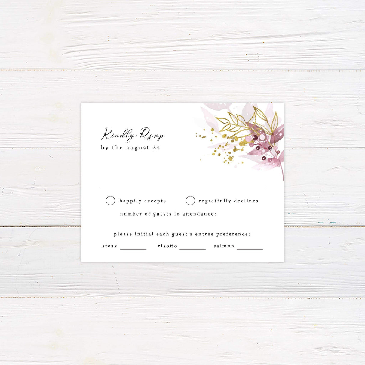 RSVP card featuring blush and burgundy leaves with gold shimmer botanical accents and elegant typography.