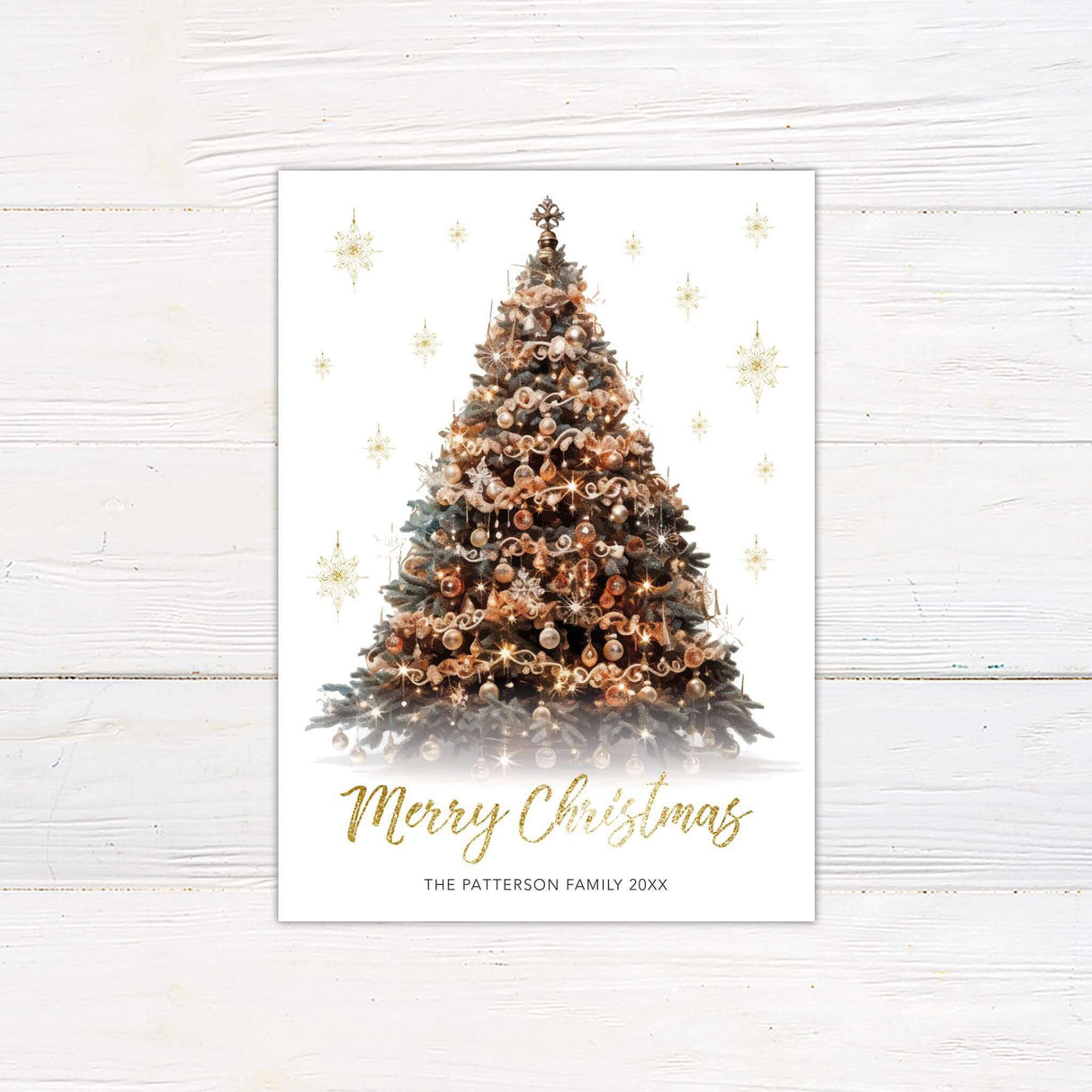 A shimmering Christmas card featuring a decorated tree with gold ornaments. The design includes a festive “Merry Christmas” greeting and family personalization.