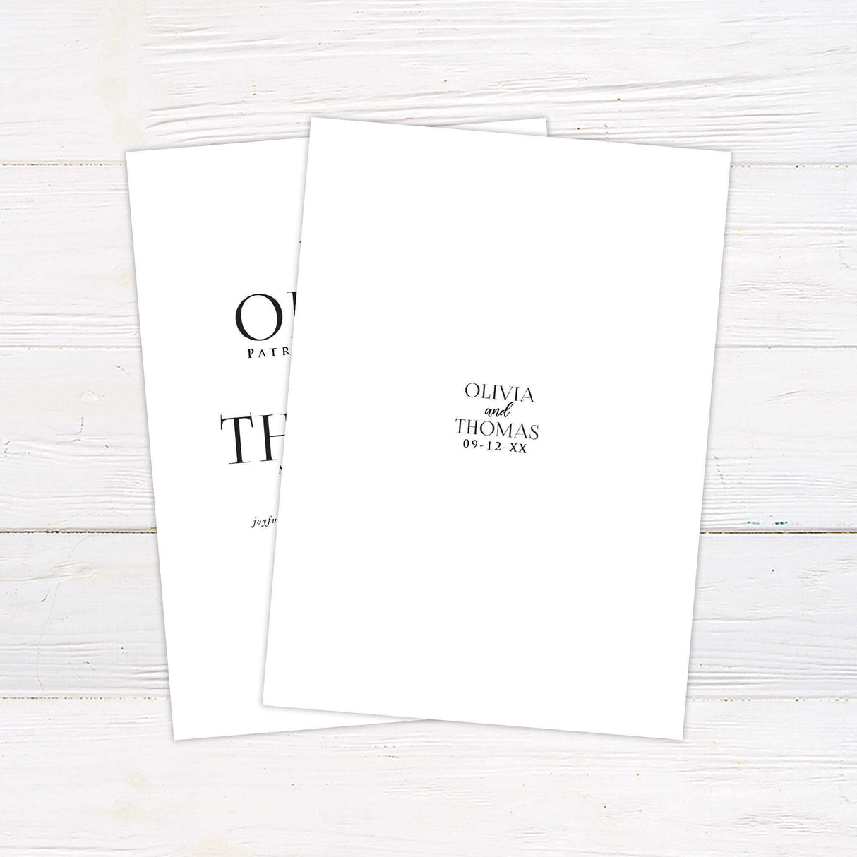 Simple wedding invitation with serif fonts and minimalist black text on white background. Back.