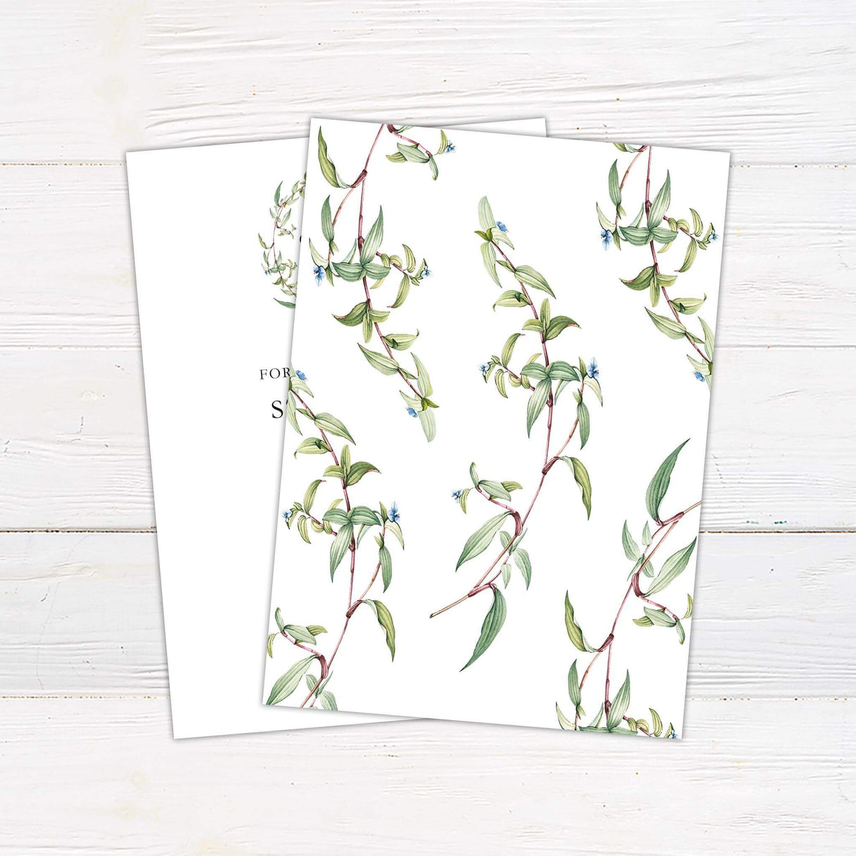 Minimalist wedding invitation with monogram wreath and botanical branch design in soft green tones- back side