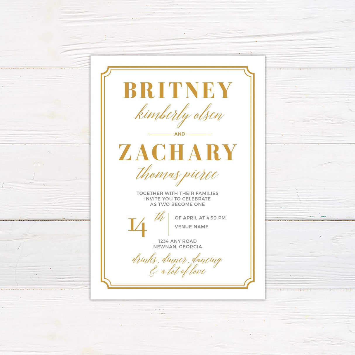 White wedding invitation with gold serif and script fonts framed in a gold border