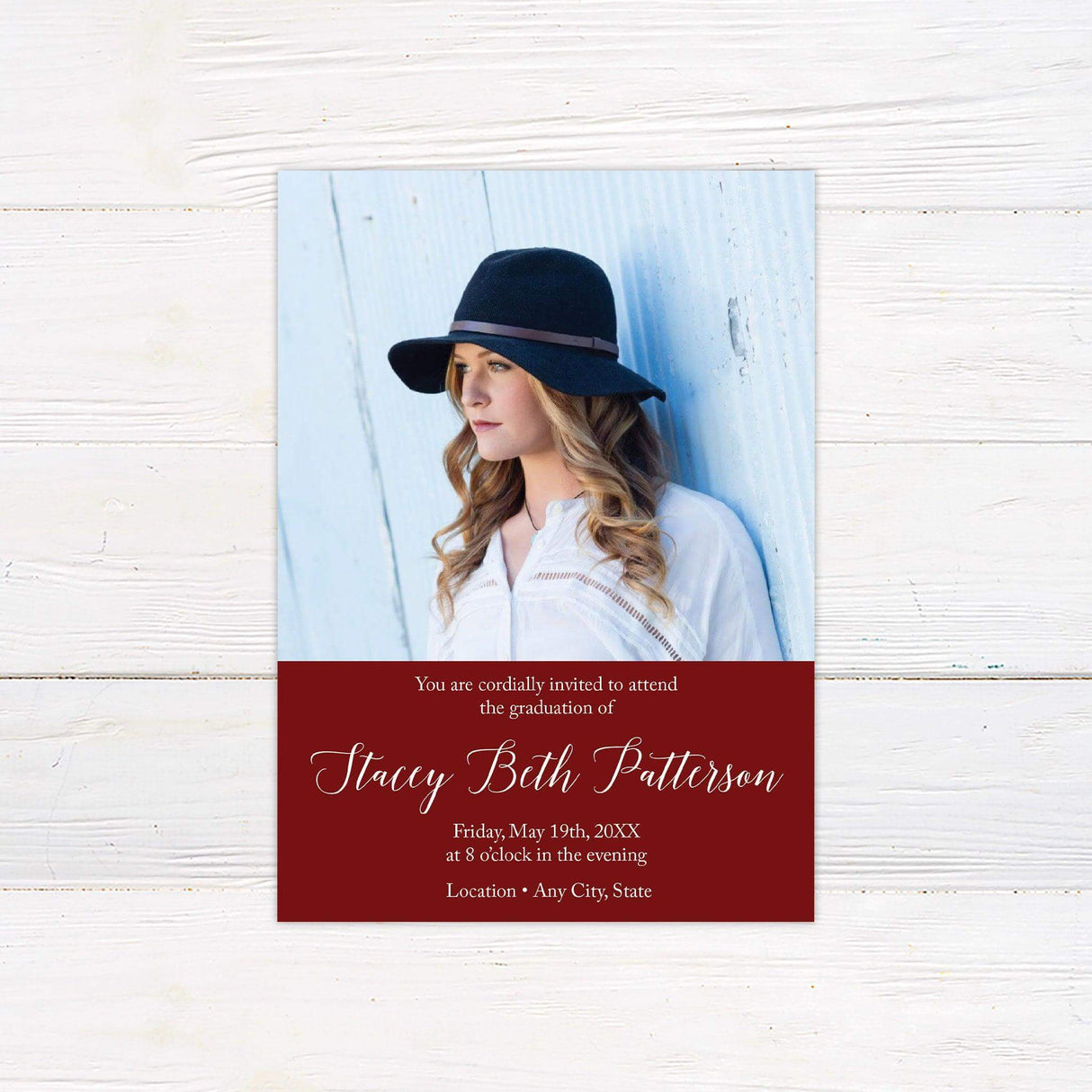 The front of a graduation invitation displaying a split design with a large photo and graduation details in an elegant font in a custom color block. Red.