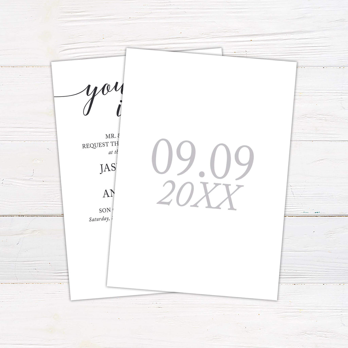 Elegant wedding invitation with "You're Invited" script in calligraphy and classic serif fonts on a white background. - back side