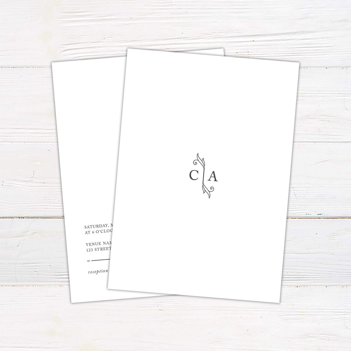 Minimalist wedding invitation with thin line accents and clean typography on white background back