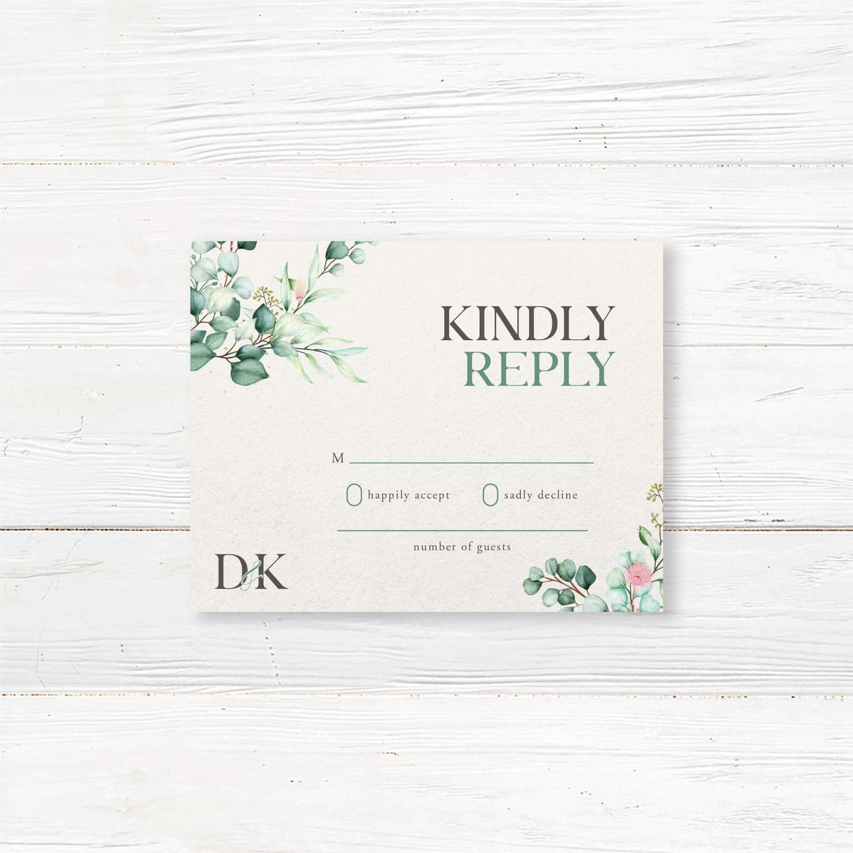 RSVP card with monogram wreath and eucalyptus greenery accents, minimalist typography on white textured card