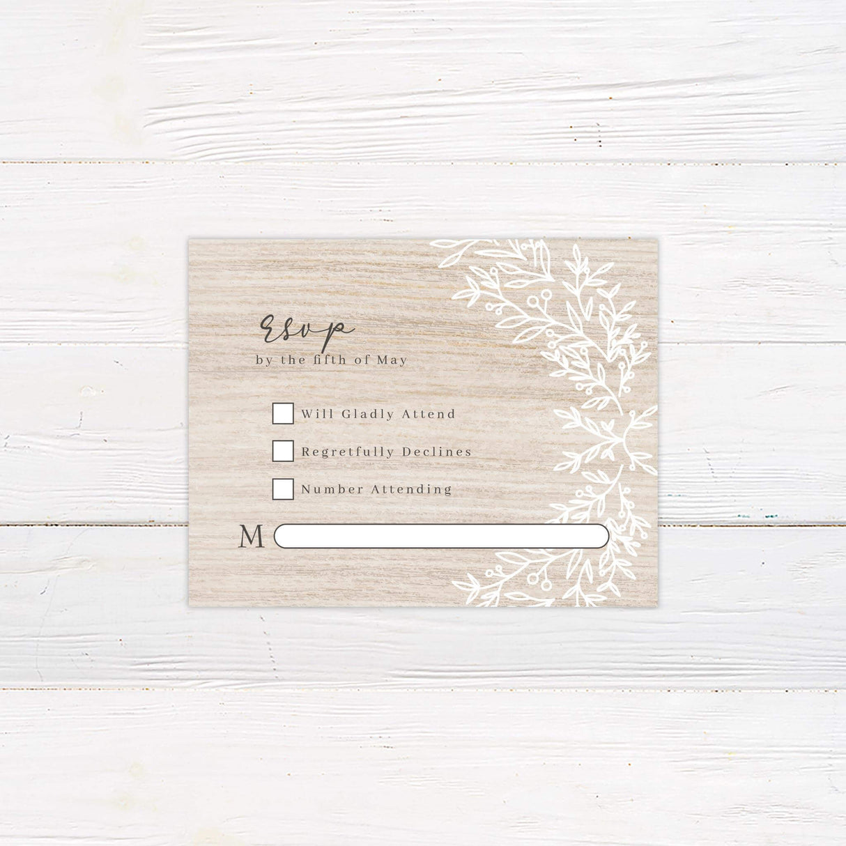 RSVP card with rustic wood background and simple script and serif fonts