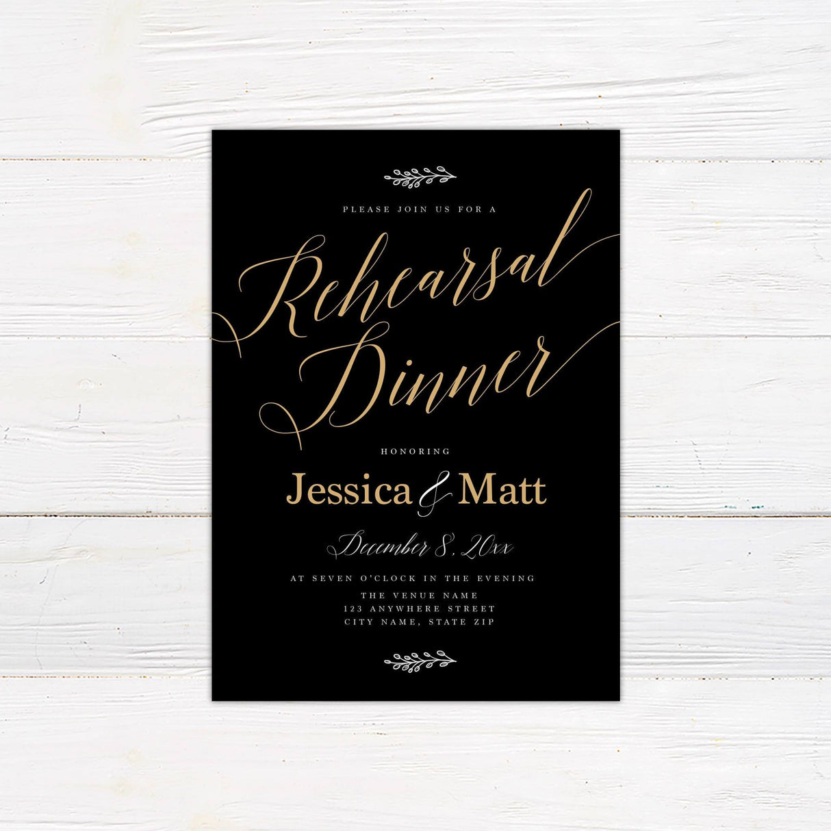 This elegant rehearsal dinner invitation features a black background with gold script for the title "Rehearsal Dinner," giving it a luxurious feel. The couple's names are displayed in a large, elegant gold font. The design is complemented by a minimalist leaf motif at the top and bottom. The date, time, and venue details are clearly laid out in a refined, modern font. This sophisticated design is perfect for couples seeking a timeless and classy way to invite guests to their special evening.