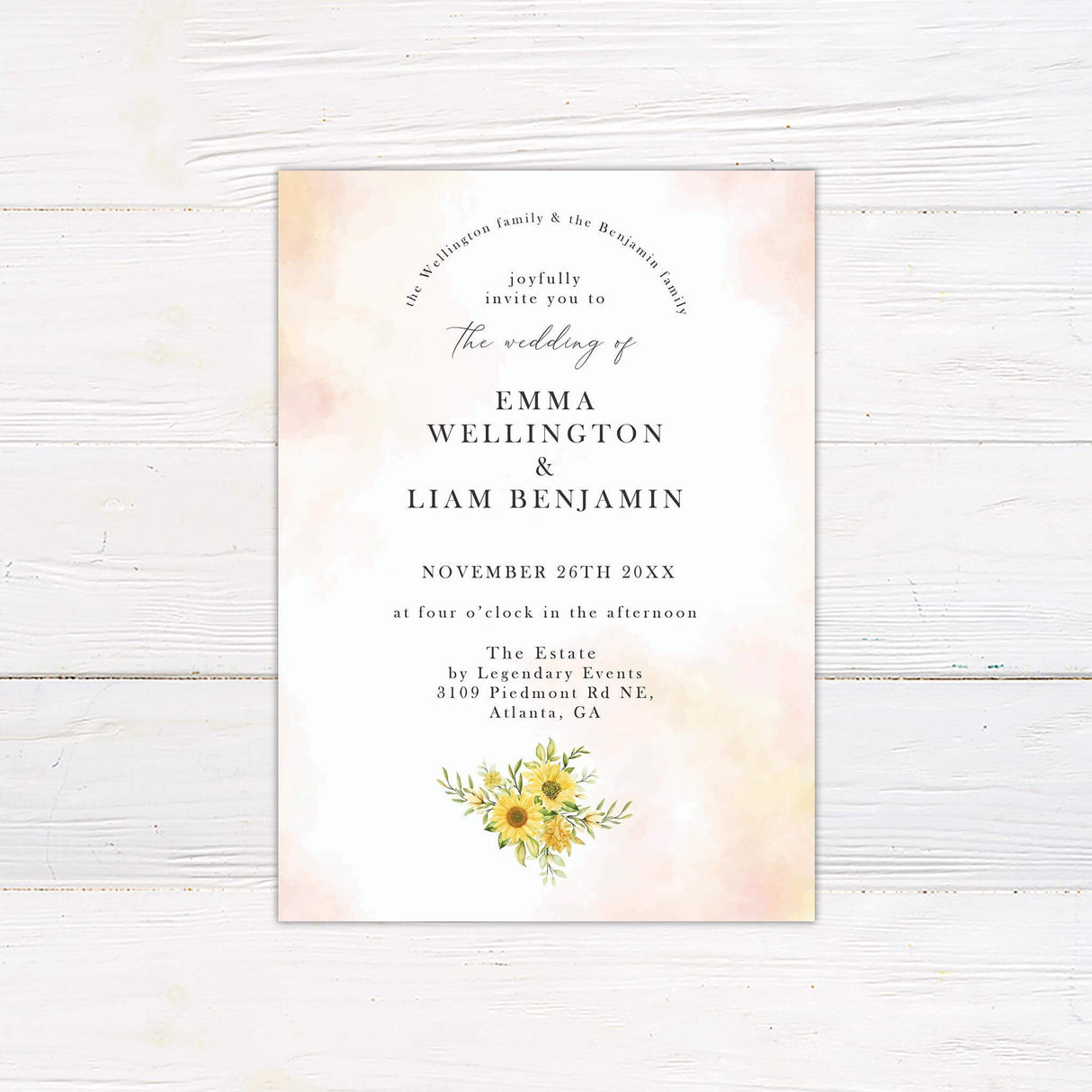 Wedding invitation with watercolor sunflowers, soft peach tones, and elegant script and serif fonts