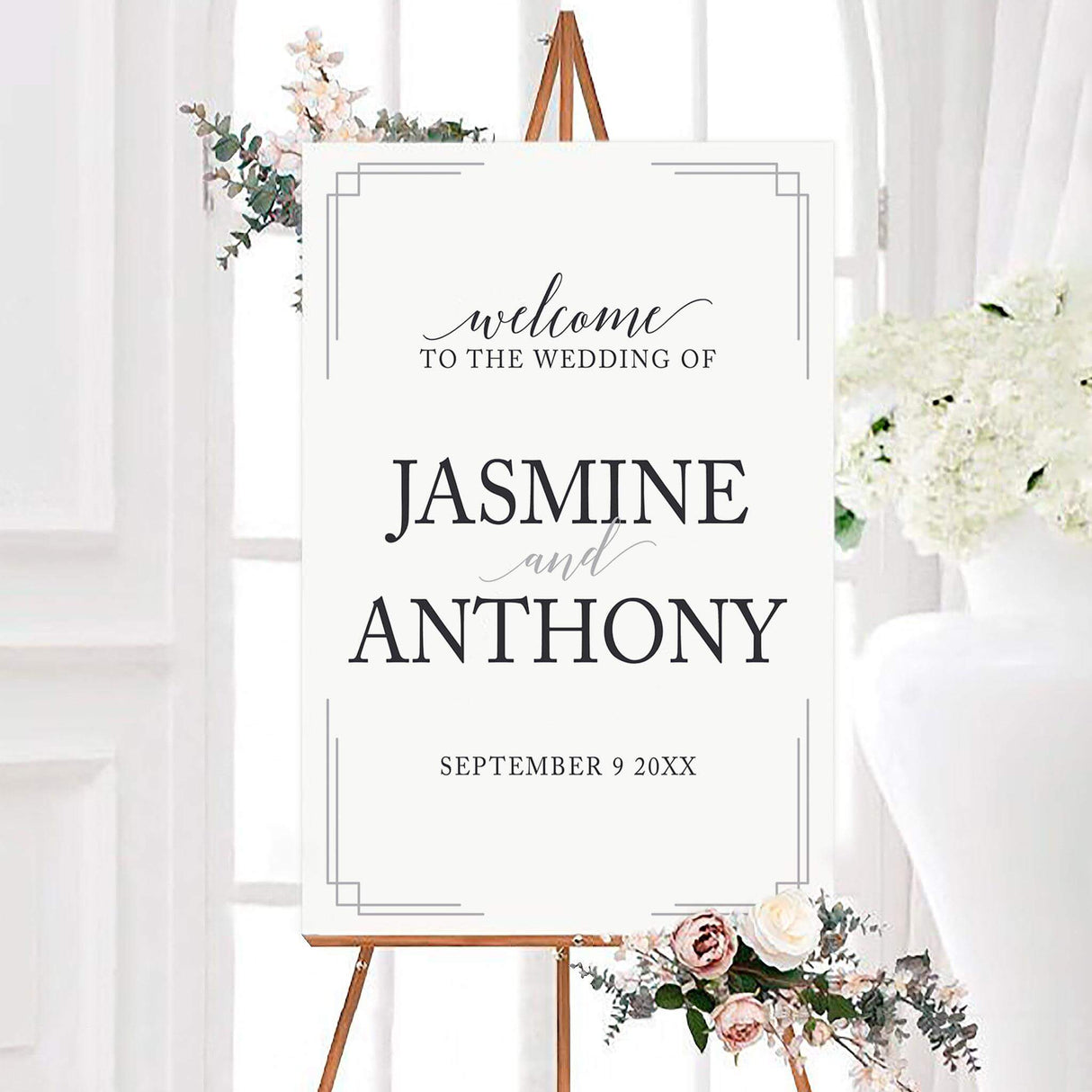 Minimalist you're invited wedding welcome sign featuring large black serif couple names, elegant script lettering, and a personalized wedding date. Thin light gray geometric corner lines frame the clean white design.