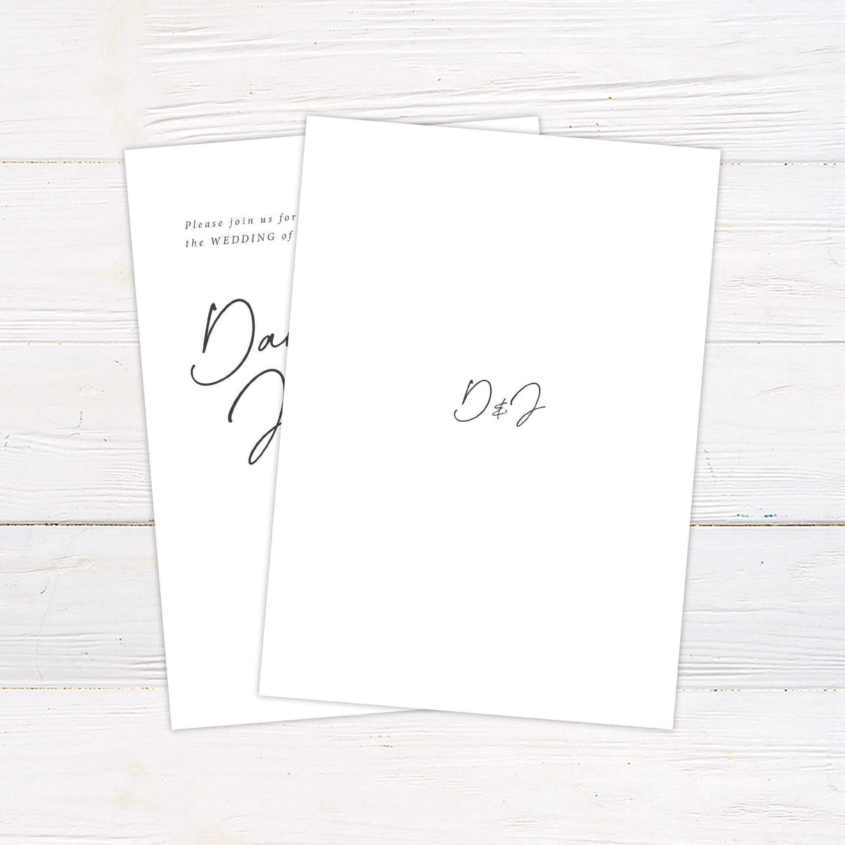 Minimalist wedding invitation with elegant script font and classic black and white design. Back.