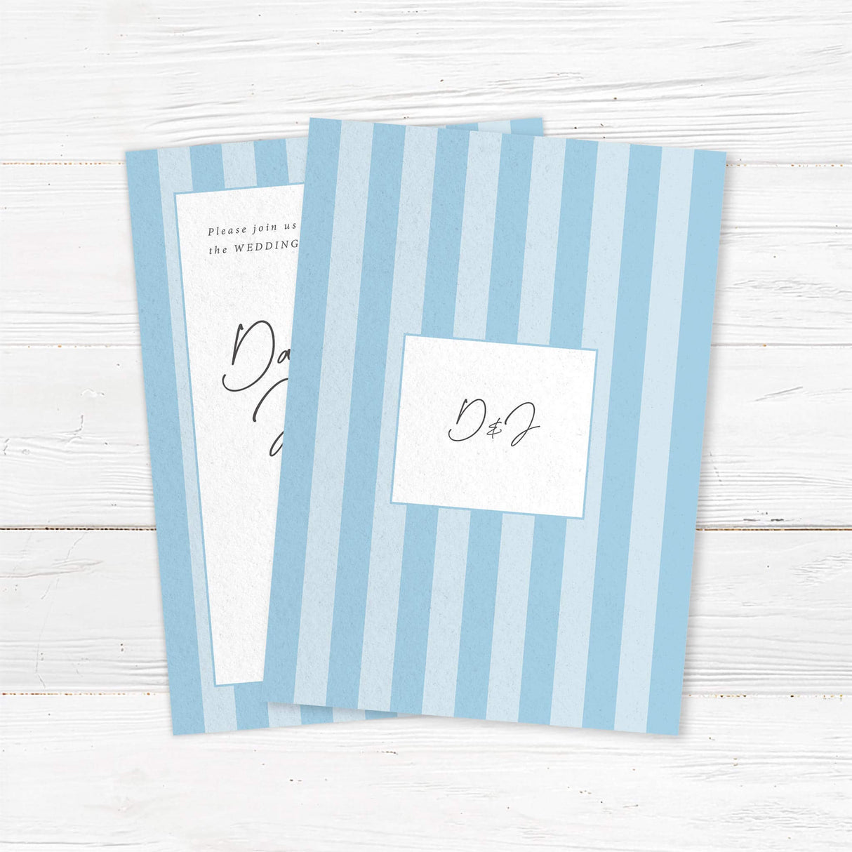 Minimalist wedding invitation with alternating soft blue and white vertical stripes, a white center panel, and elegant handwritten script and serif font layout for a clean modern wedding style. - back side