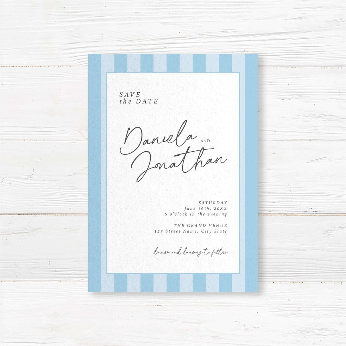 Save the Date card featuring soft blue and white vertical stripes, clean white center panel, minimalist text in script and serif fonts, ideal for spring and modern weddings.