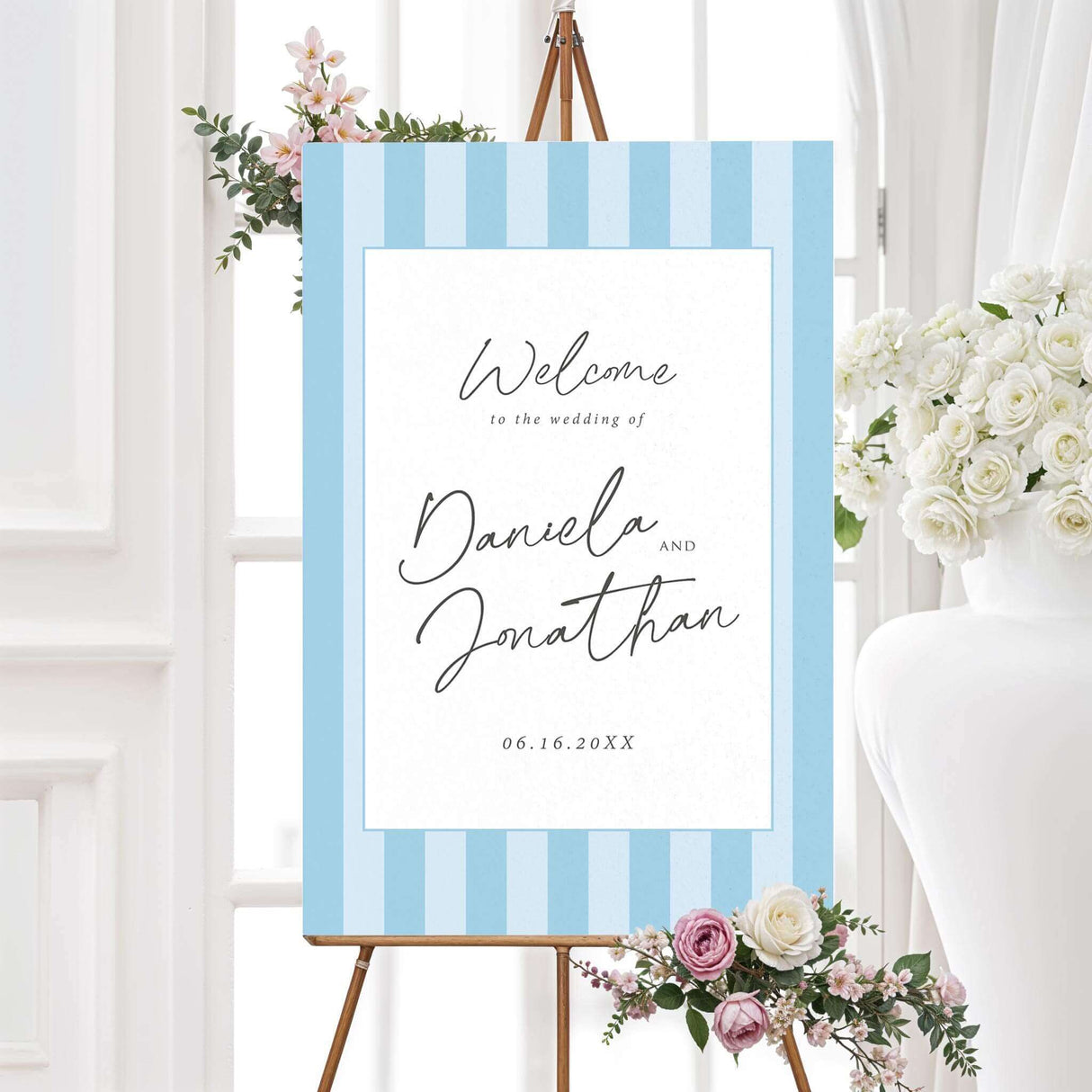 Wedding welcome sign with vertical soft blue and white stripes, clean white panel, and handwritten script and serif font combo, matching the Simply Written wedding suite.